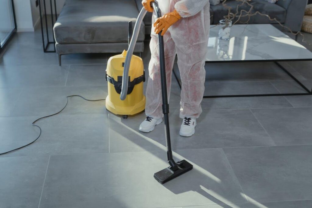 close-up of a person using a vacuum cleaner