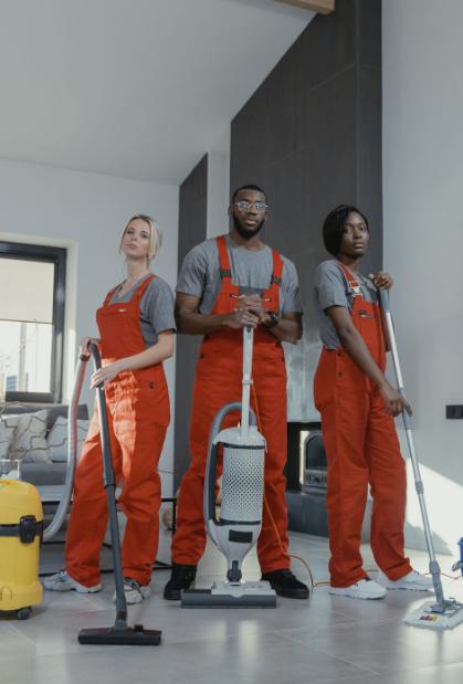 This image shows three professional cleaners standing together.