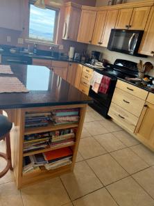 a view of a kitchen with the grout lines visible on the tiles