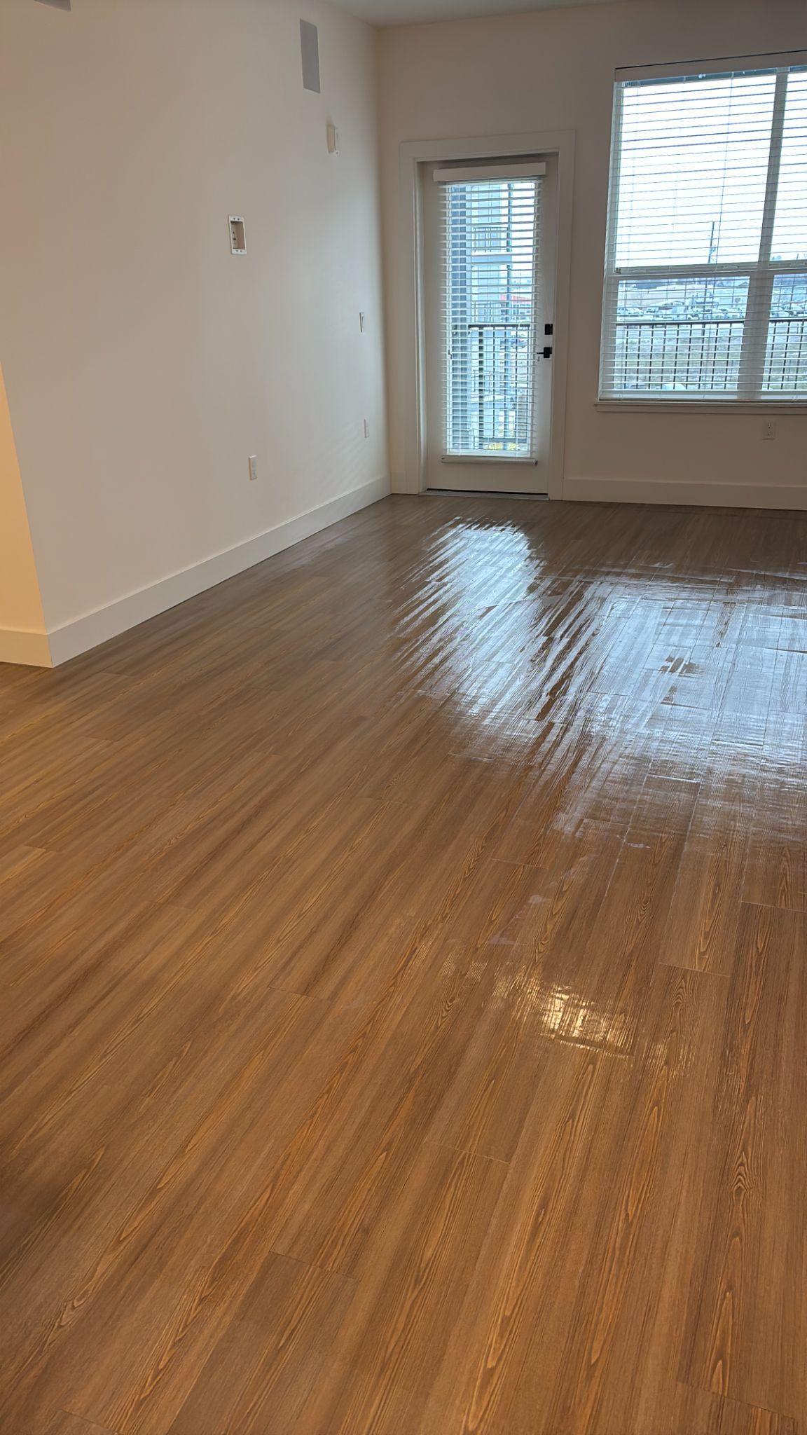 an empty room with LVT flooring