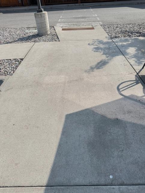 An image of a clean concrete walkway outside a commercial property
